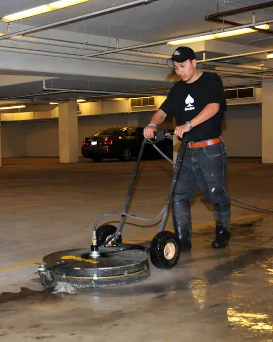 man cleaning a parking garage